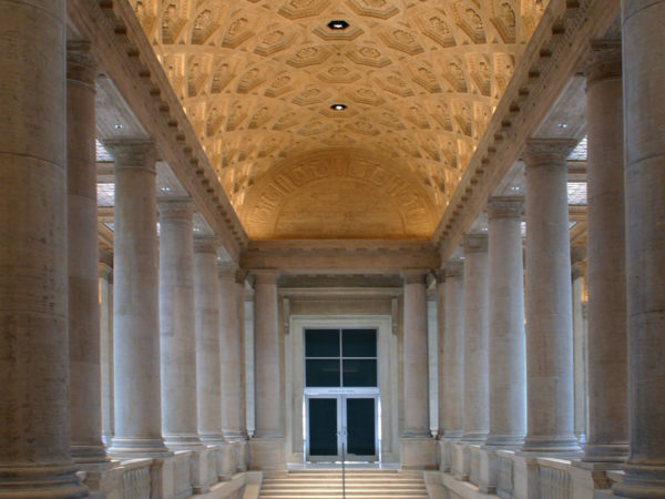 Image of stairs leading up to double doors, with an illuminated ornate ceiling overhead