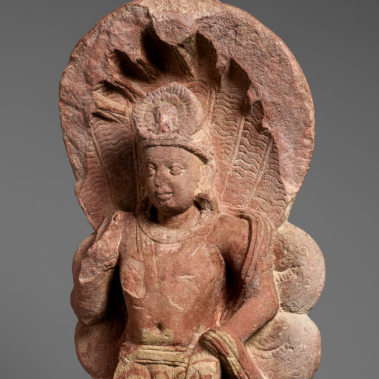 Sandstone sculpture of a serpent king.