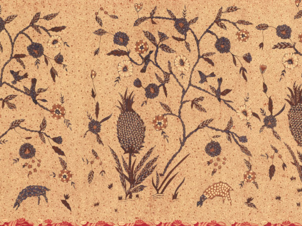 Rectangle of beige fabric with a repeating scene in browns, greens, and yellow of a pineapple plant and grazing animal below a flowering tree with birds alighting on its branches.